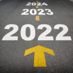 Road with arrows pointing towards upcoming years